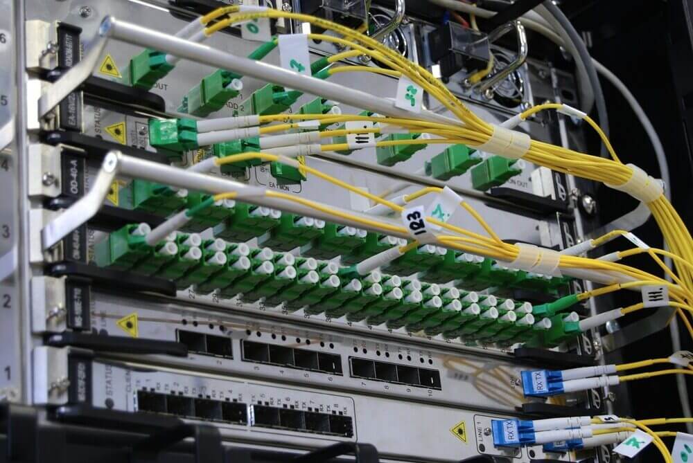 Server room with cables running to servers.