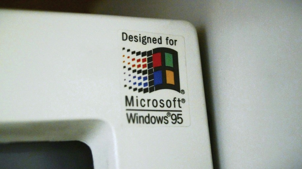 Old computer monitor with made for windows 95 sticker.