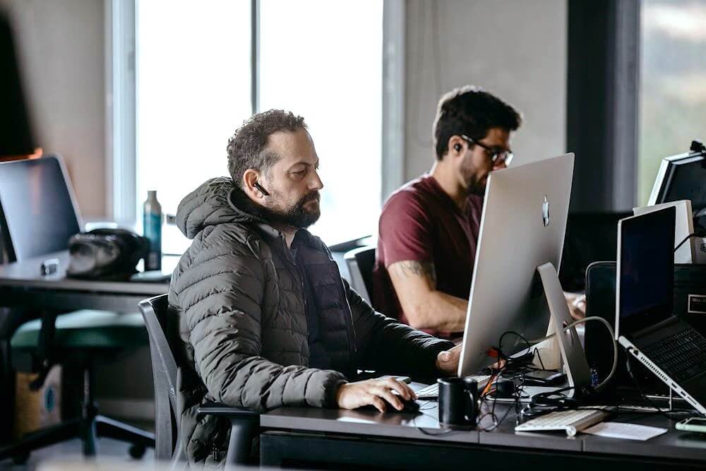 Woman writing code for a clients project.